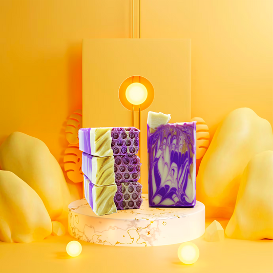Three bars of soap with purple and white swirls on a wooden block against a yellow background