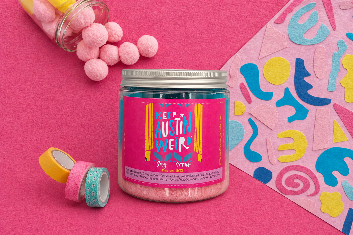 Jar of pink sugar scrub with colorful packaging on a pink background, MADE IN AUSTIN, ORGANIC SUGAR SCRUB, SUMMER SCENT